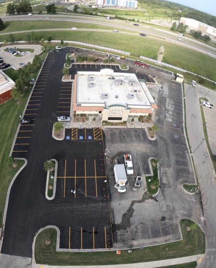 Aerial view of commercial parking lot paving work