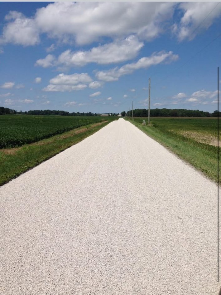Long light-colored rural private road